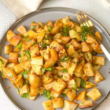 cubed potatoes and cilantro with spices