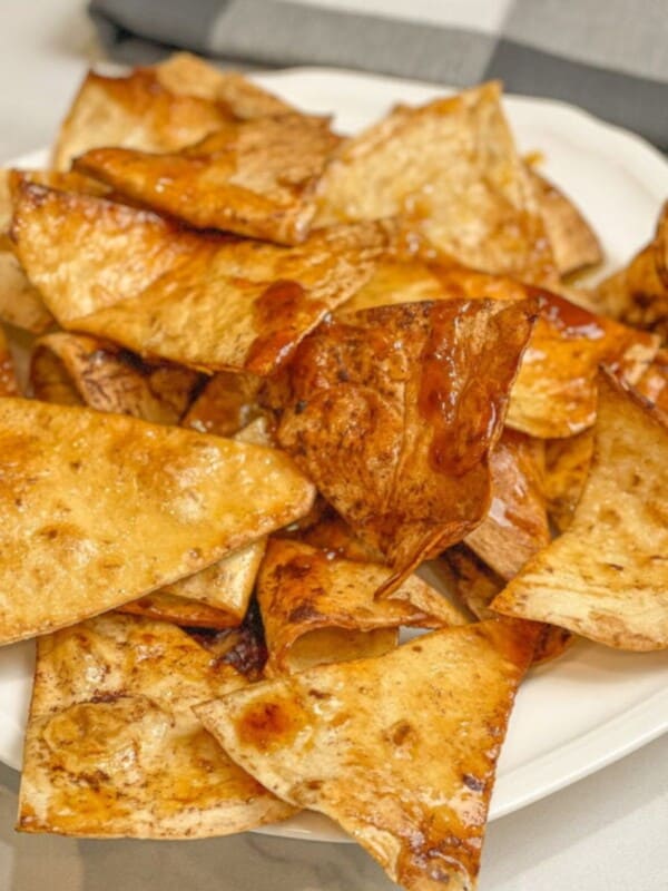 crispy air-fried honey tortilla chips served on a white plate