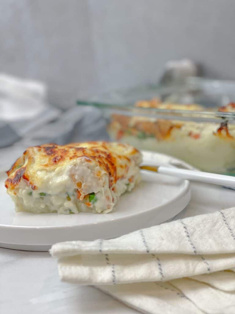 A creamy, delicious, and cheesy potato and chicken bake with veggies