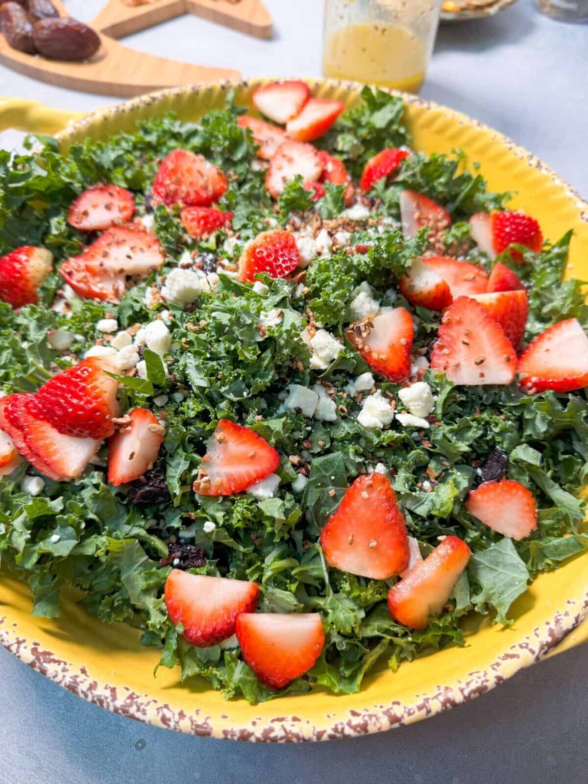 Dijon Vinaigrette Kale Salad A vibrant Kale Dijon Salad with fresh kale, juicy strawberries, dried cranberries, pecans, and creamy feta cheese, drizzled with tangy Dijon dressing.