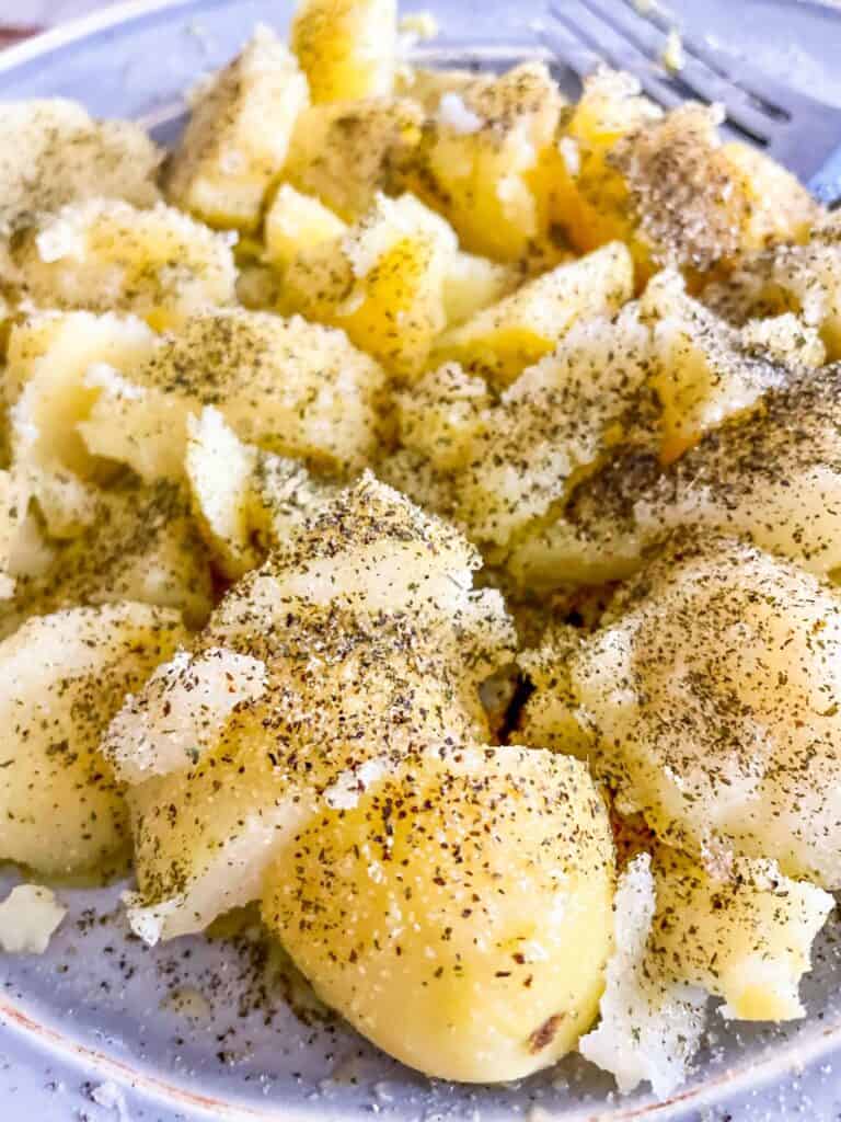 Delicious and creamy boiled potatoes, tossed in extra virgin olive oil with garlic and fresh herbs.