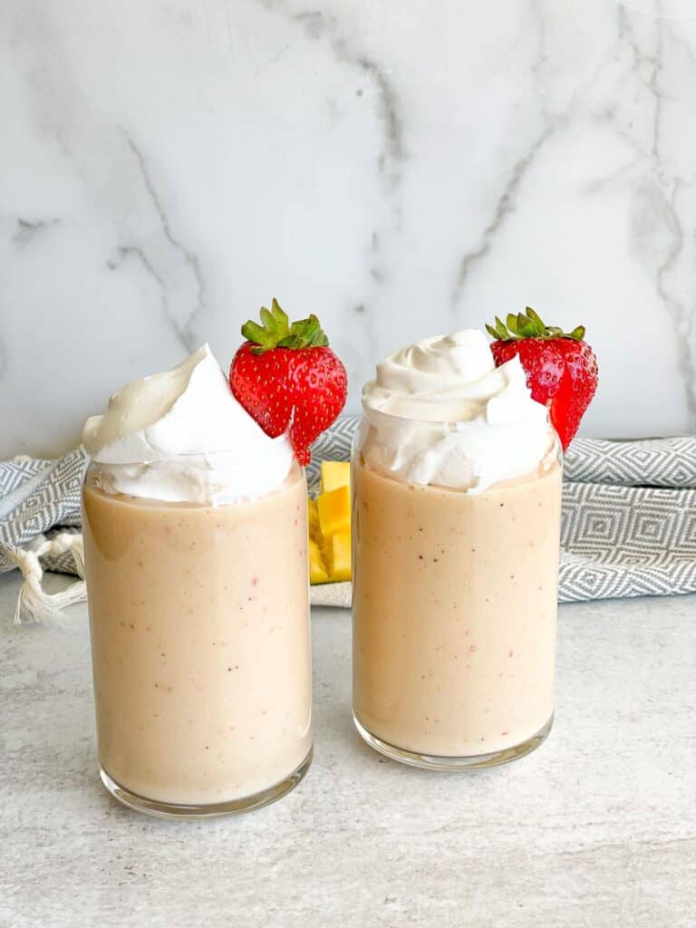 The fresh strawberry, ripe banana and tasty mango takes you on a tropical vacation. Add extra vitamins like C, D, and zinc to get extra energy. Top with whip cream and a strawberry on the side of the glass