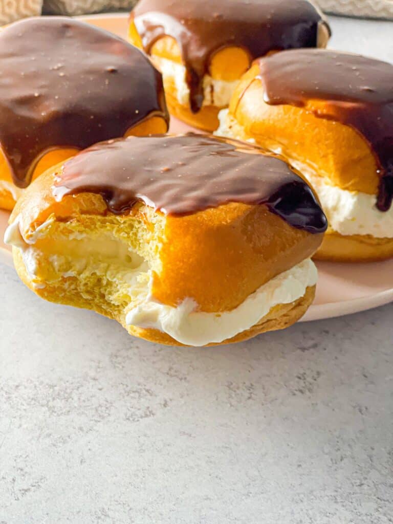 These 5 Minute Brioche Cream Buns are such a heavenly treat filled with luscious whipped cream and glazed with chocolate ganache; it's hard to stop at one.