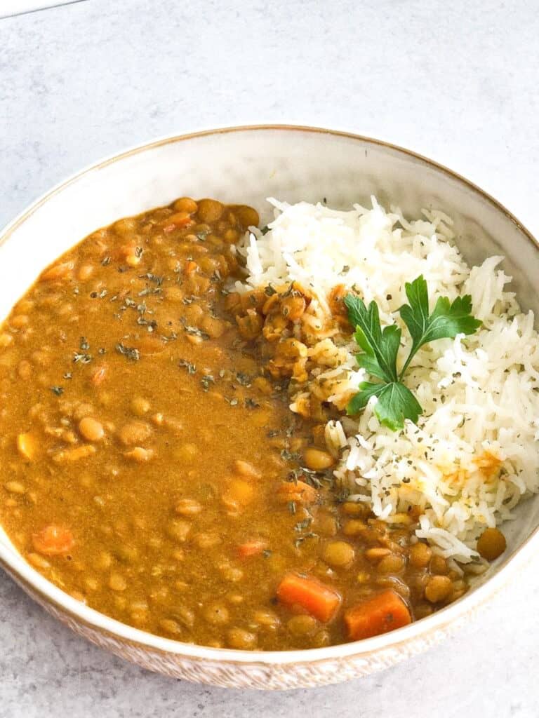 This Creamy Brown Lentil Dhal recipe is a comforting mixture of brown lentil, spices, and vegetables. It is best served with rice, quinoa, or salad