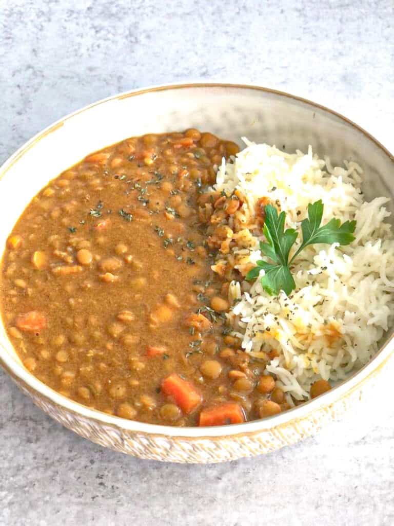 This Creamy Brown Lentil Dhal recipe is a comforting mixture of brown lentil, spices, and vegetables.