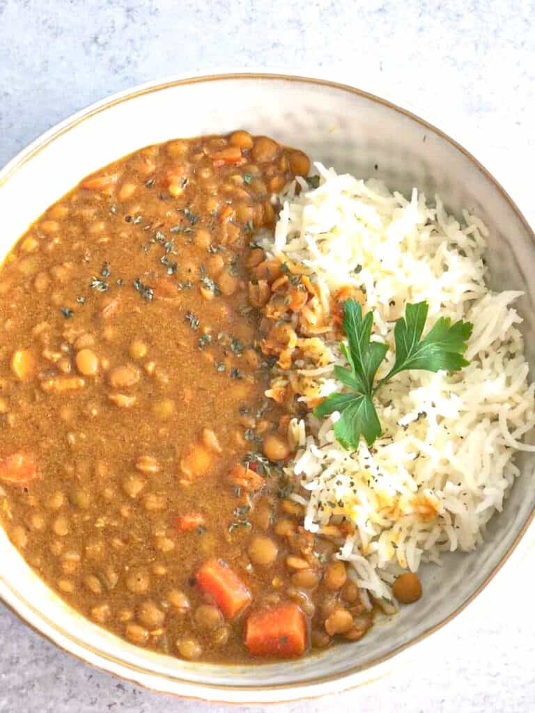 This Creamy Brown Lentil Dhal recipe is a comforting mixture of brown lentil, spices, and vegetables. It is best served with rice, quinoa, or salad
