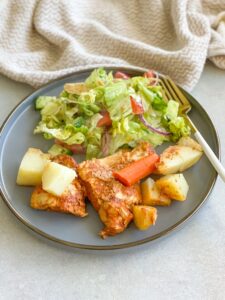 This Baked Chicken and Potatoes recipe makes it easy for you to deliver the comfort food your family craves. It is made with flavorful, succulent, tender chicken breasts and cubed potatoes and carrots marinated in a garlicky lemony tomato sauce with a touch of cumin and paprika.