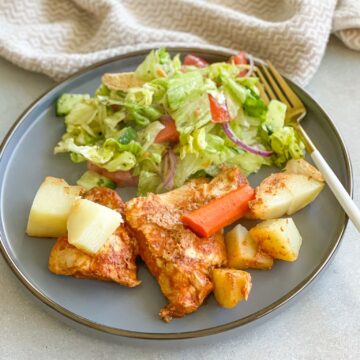 This Baked Chicken and Potatoes recipe makes it easy for you to deliver the comfort food your family craves. It is made with flavorful, succulent, tender chicken breasts and cubed potatoes and carrots marinated in a garlicky lemony tomato sauce with a touch of cumin and paprika.