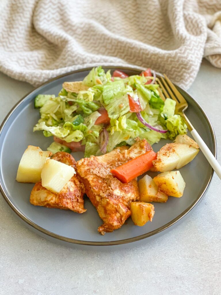 Tender and juicy chicken breasts with cubed potatoes served with Mediterranean salad.