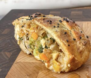 Cheesy chicken puff pastry loaded with your favorite vegetables