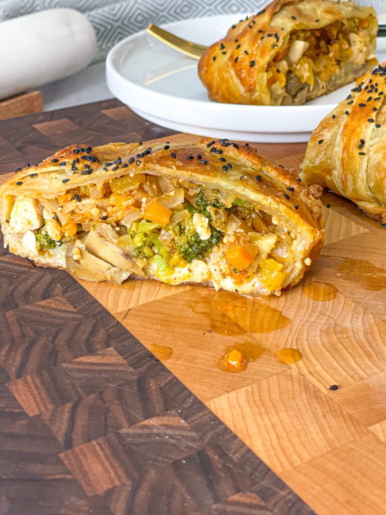Scrumptious puff pastry stuffed with chicken breasts and veggies. Serve it hot and enjoy the cheesy taste.