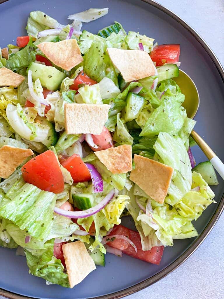 A simple traditional Lebanese salad  with a mixture of salad vegetables, toasted pita bread and a delicious  dressing, for a quick, healthy meal.