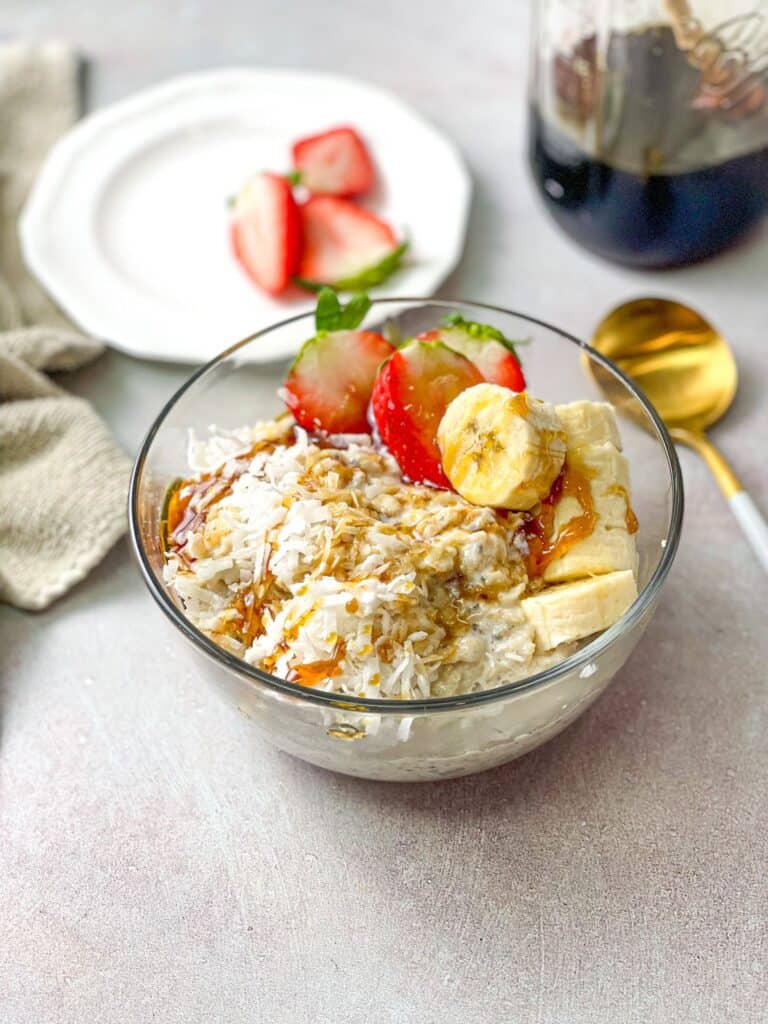 oatmeal pudding with  blossom water, banana, and strawberry slices. Drizzled sweet honey on the top before serving.