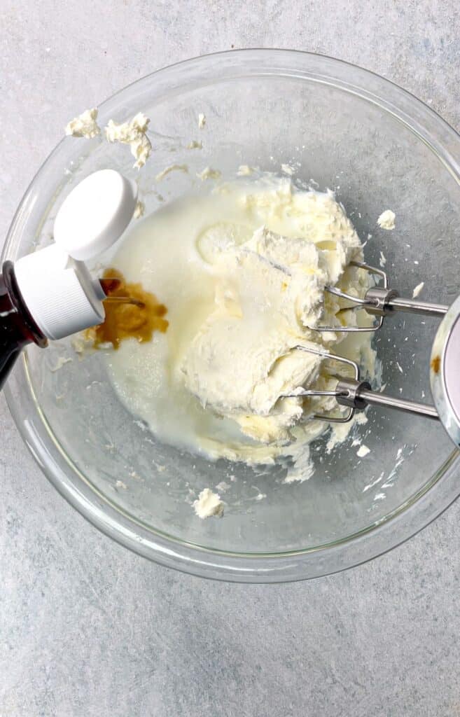 Add vanilla to the cheese and cream cheese.