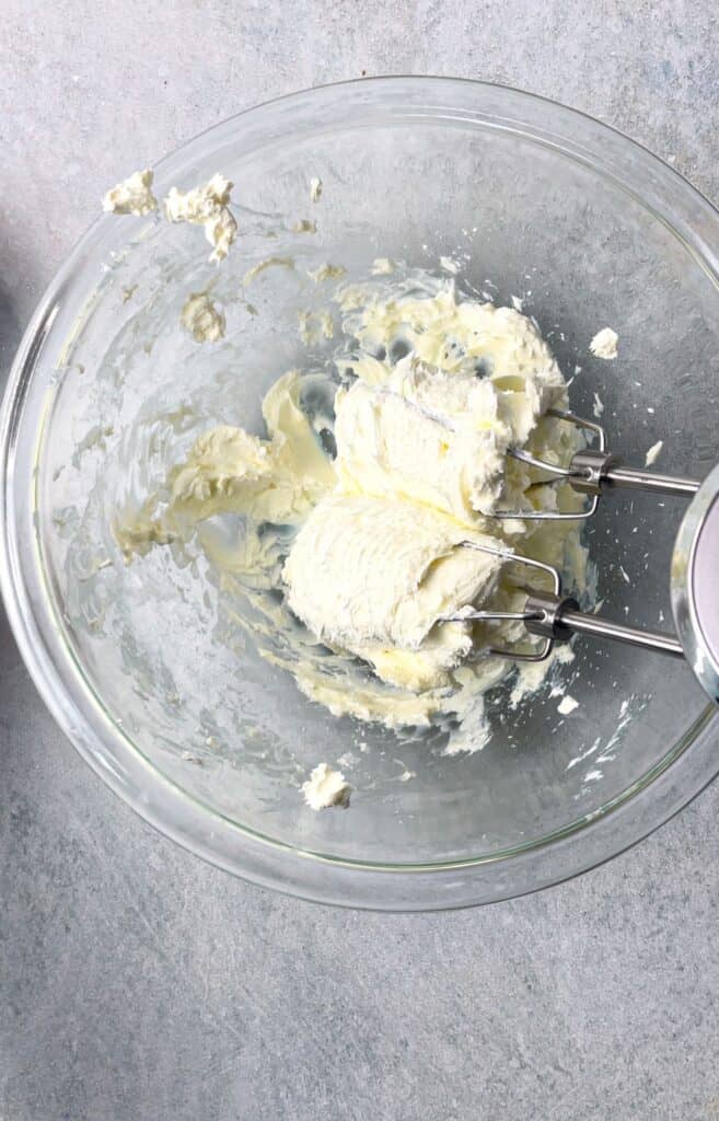 Whip the cream cheese with a hand mixer.