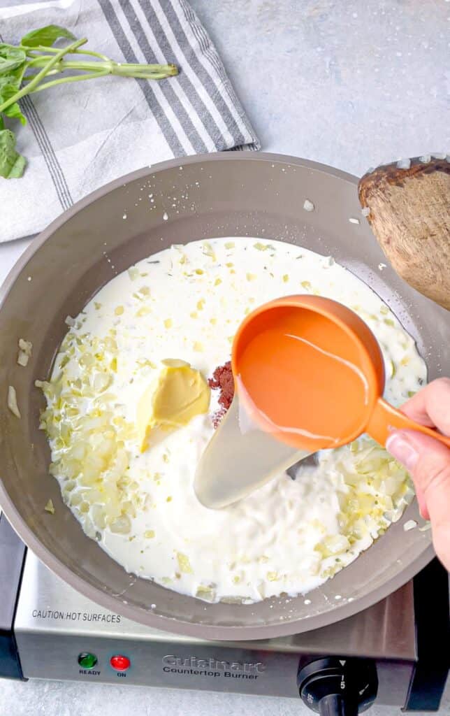 Add pasta water to sauce to help thicken it for gigi hadid alla vodka pasta recipe