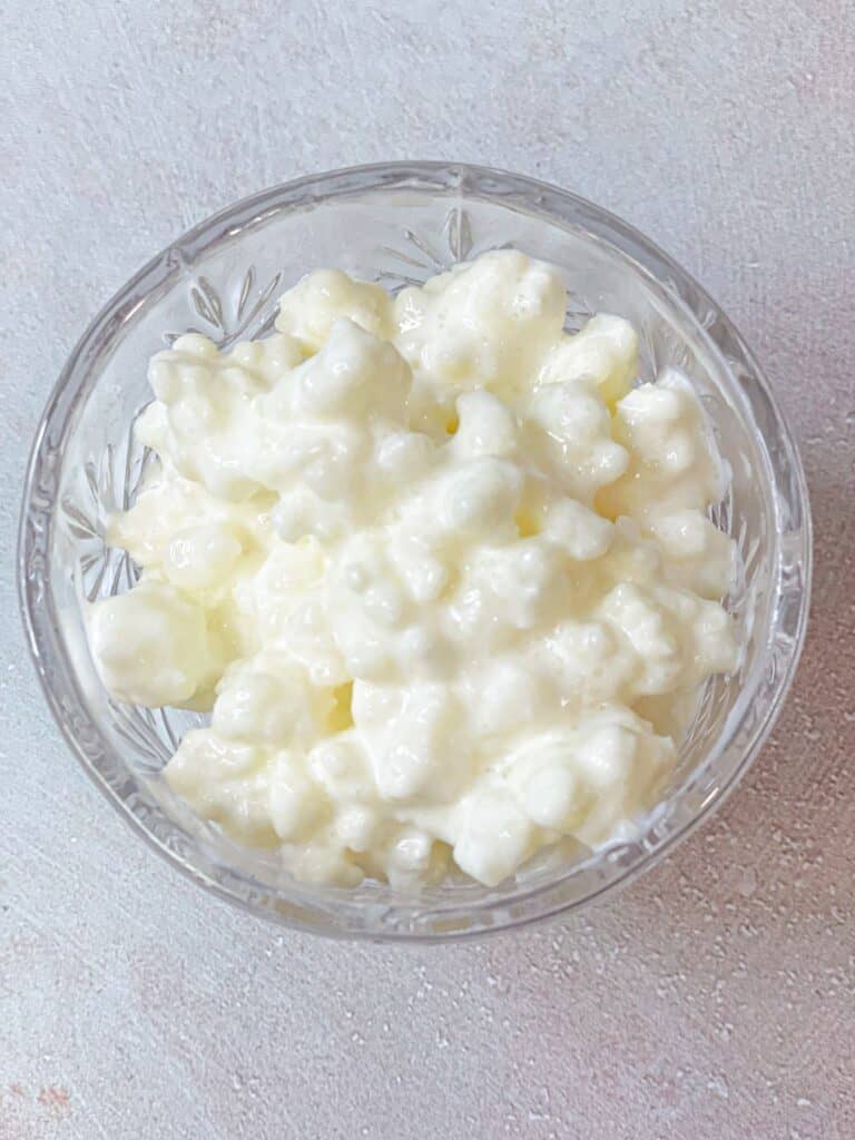 Kefir grains strained and collected to be used in making new batches of kefir