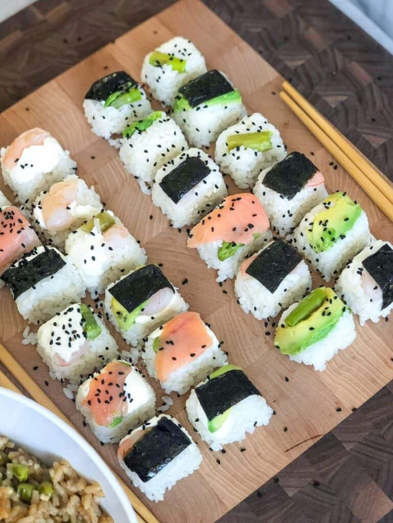 This recipe introduced cooked rice coasted with a homemade vinegar mix, sushi nori sheet, and your preferred addition of fish, vegetables, or fruits, made in ice cube trays! 