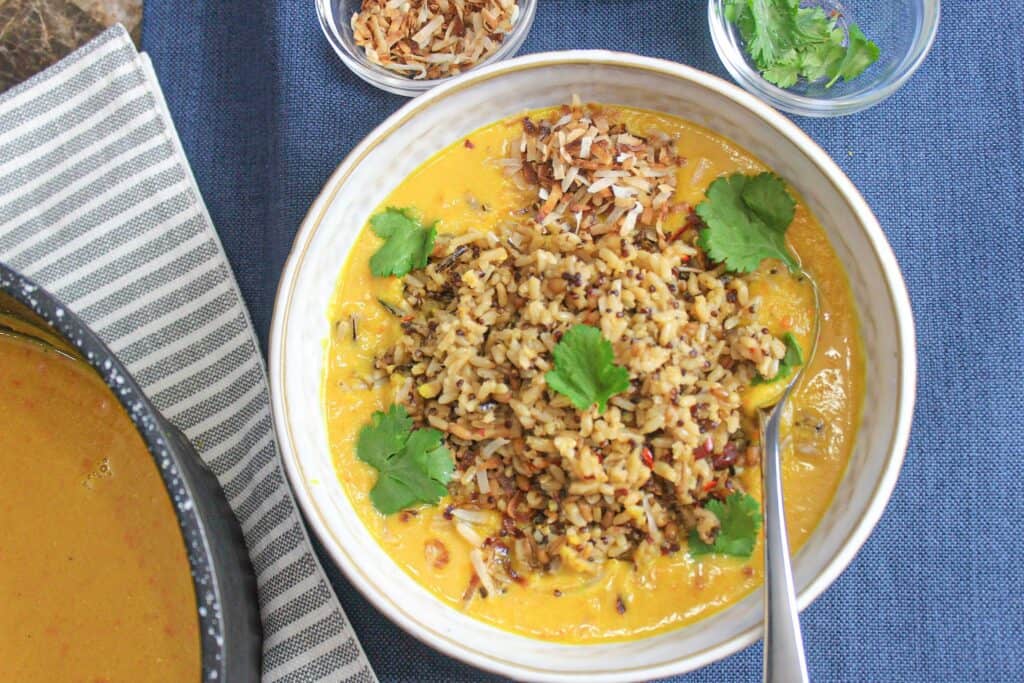 Ginger, turmeric, and coconut milk  lentil stew is super flavorful, beautiful, and extra hearty.. It makes the perfect quick vegan dinner recipe!
