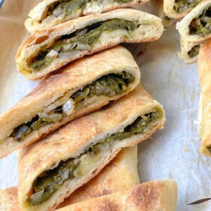 The spinach pie pockets are filled with a savory sumac-spiced spinach mixture and baked until golden