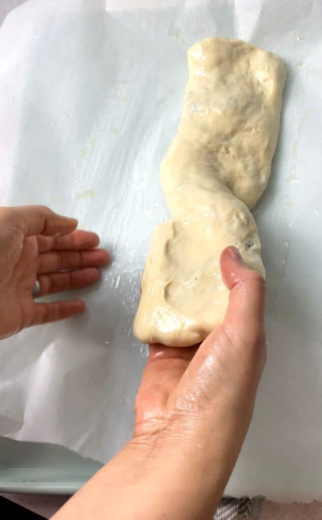 The dough is flipped gently to the other side.