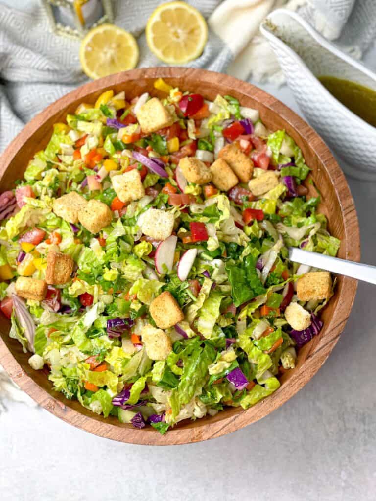 A bowl of delicious fattoush with special dressing topped with crunchy croutons is simply irresistible.