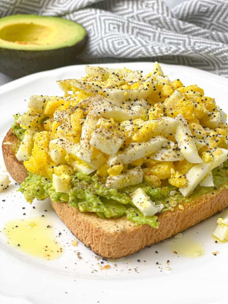 The perfect breakfast toast made with avocado and grated eggs. The grated egg on top is light and fluffy and a great way to add more protein to your breakfast! 