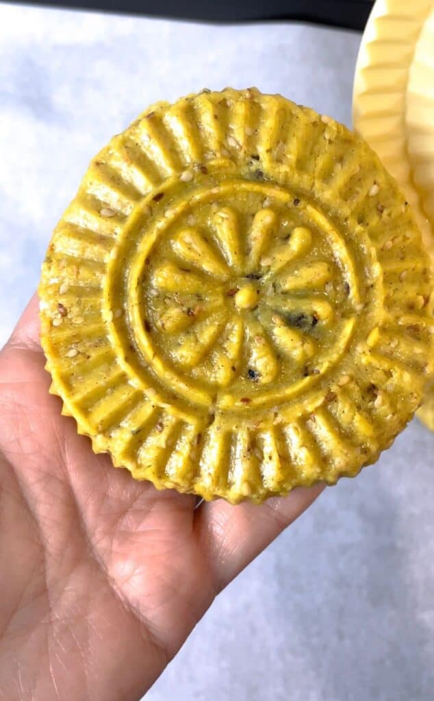 Place the dough inside an oiled kaak mold and watch all the beautiful designs come to life