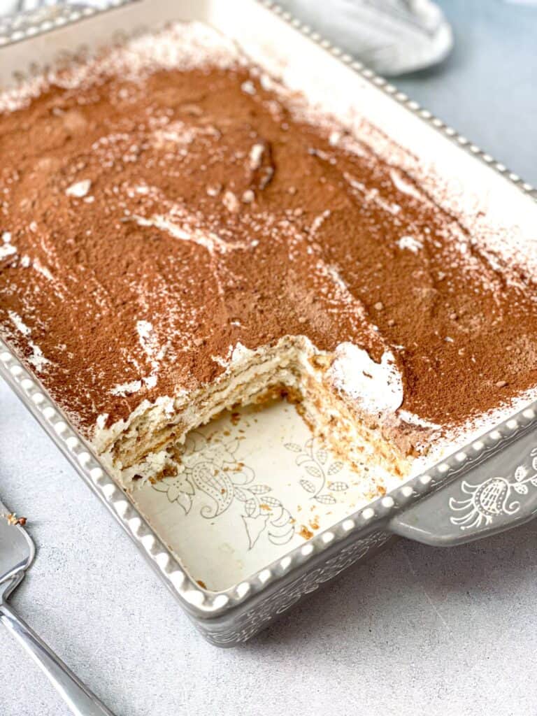 Layers of biscuits dipped in nescafe topped with a delicious cream make this delicious no bake nescafe cake.