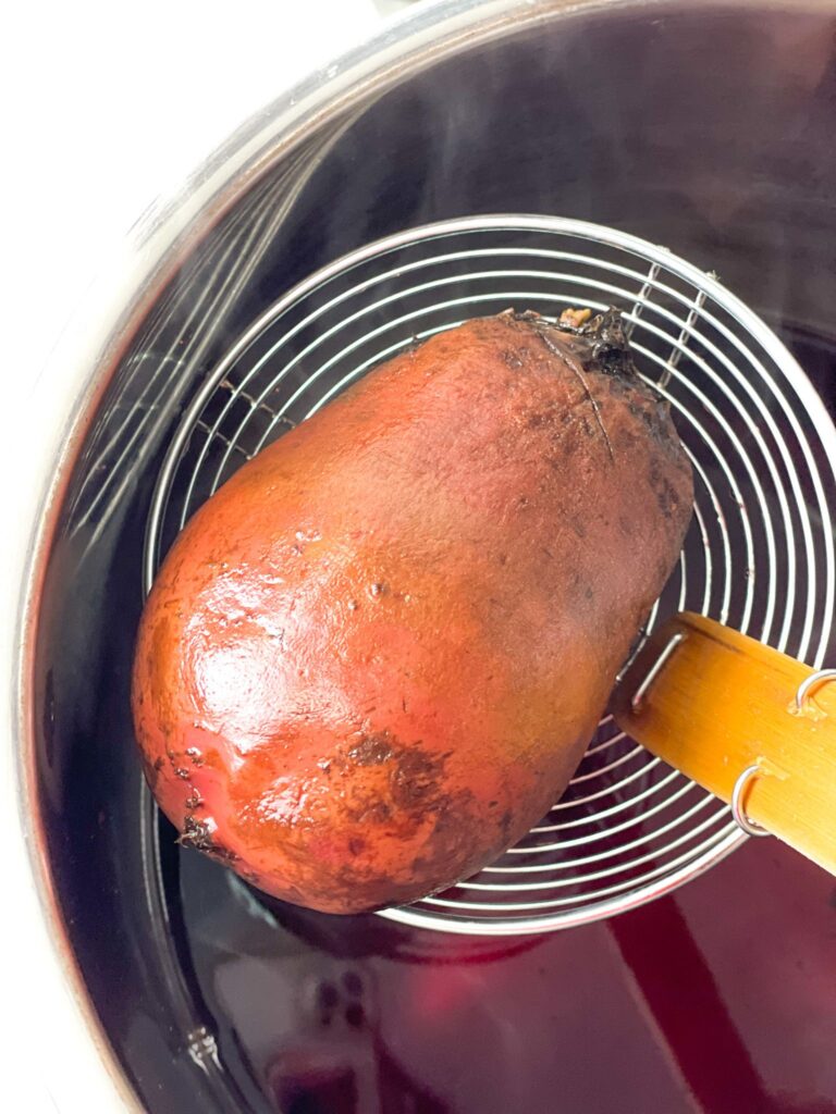 cooked beet in the sieve