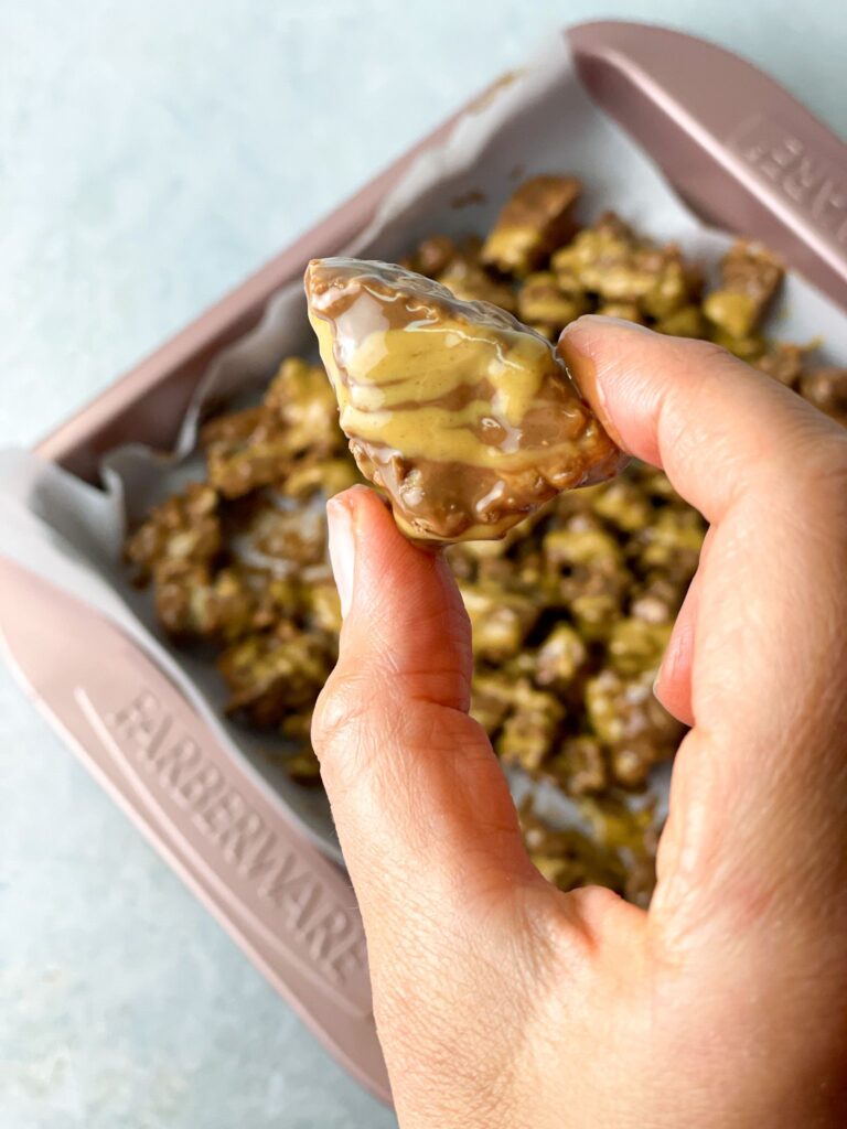 This bite-sized piece of rice cake, covered with chocolate and drizzled with peanut butter, is oh-so-yummy!