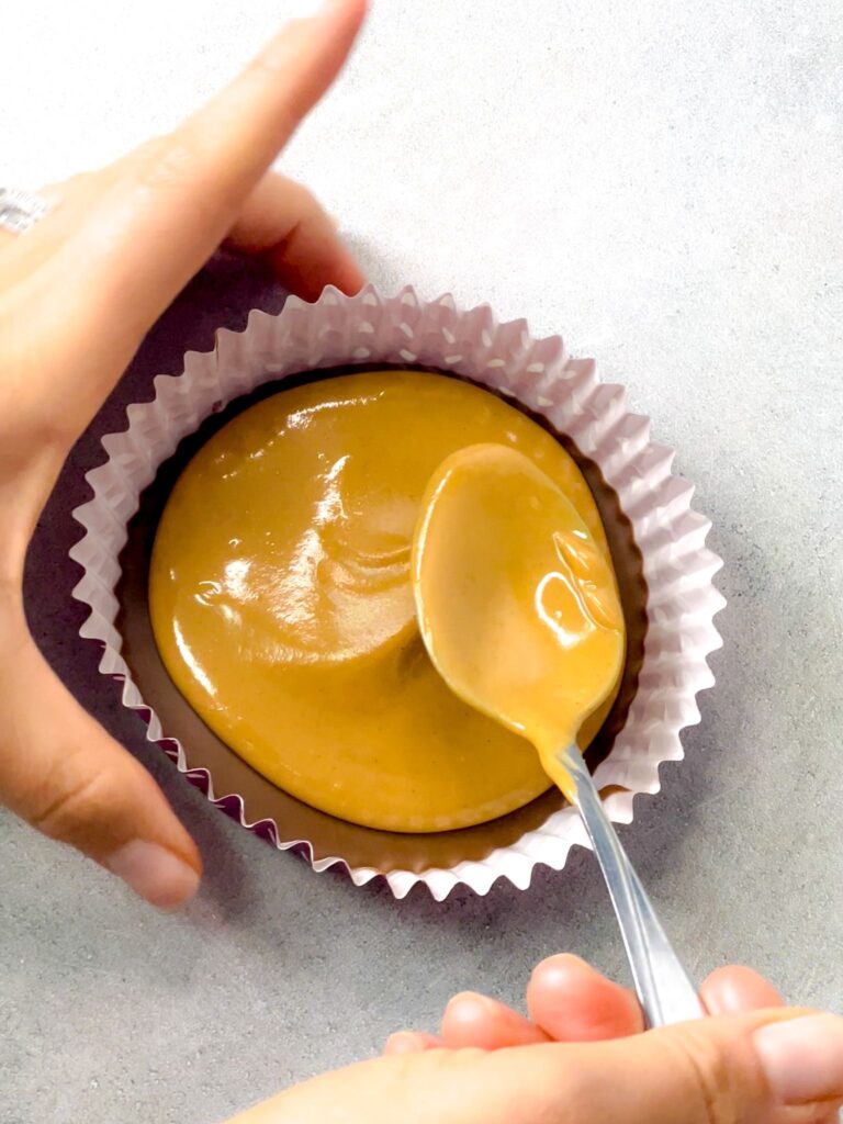 a melt in your mouth chocolate layer topped with a spoon of the peanut butter filling