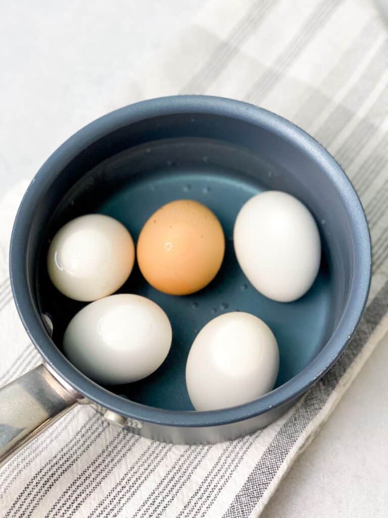 four white and one red hard boiled egg