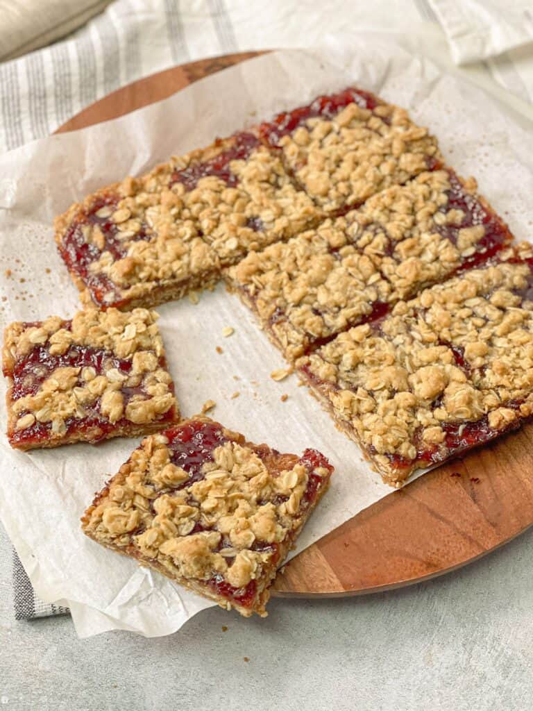 These homemade protein jam bars are made of a wholesome mixture of flour, oats, brown sugar, coconut oil, syrup, and your favorite flavor of jam.