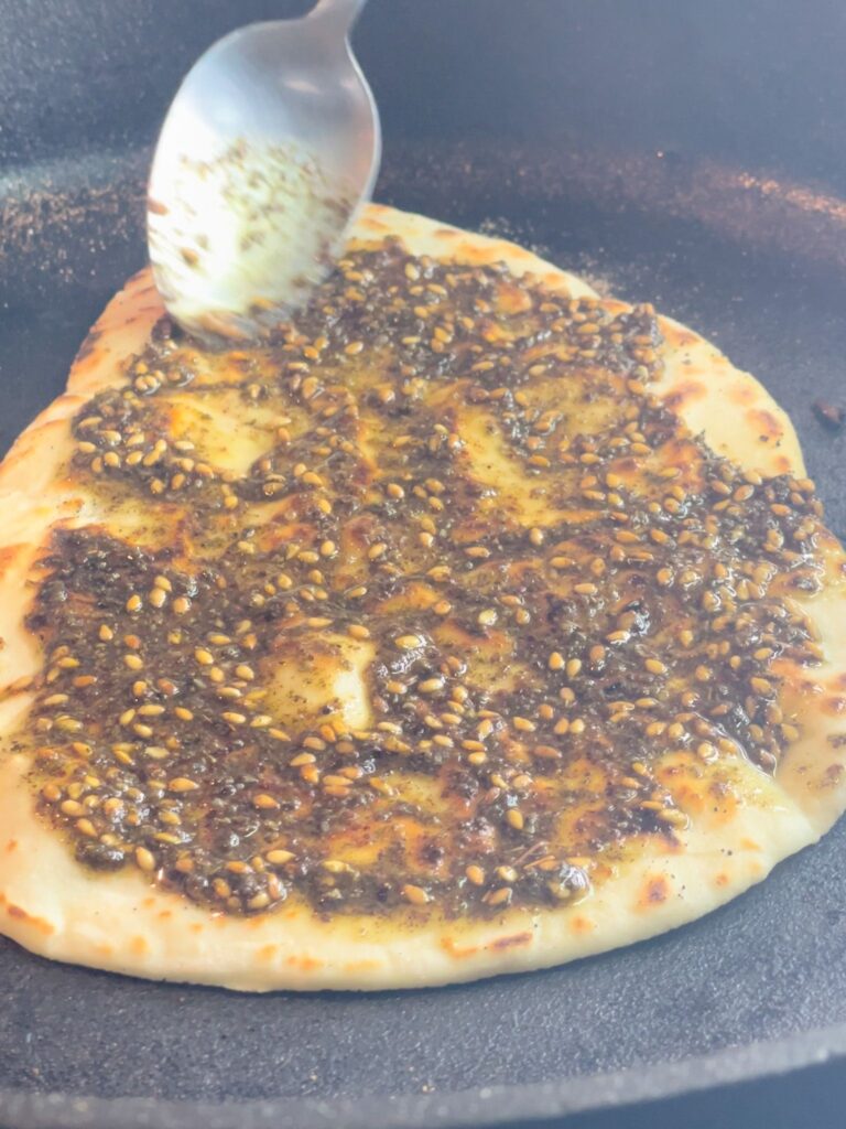 This Gluten-Free Zaatar Flat Bread recipe introduces a fire burning 3-ingredients dough topped with a savory and aromatic zaatar spice mix. 