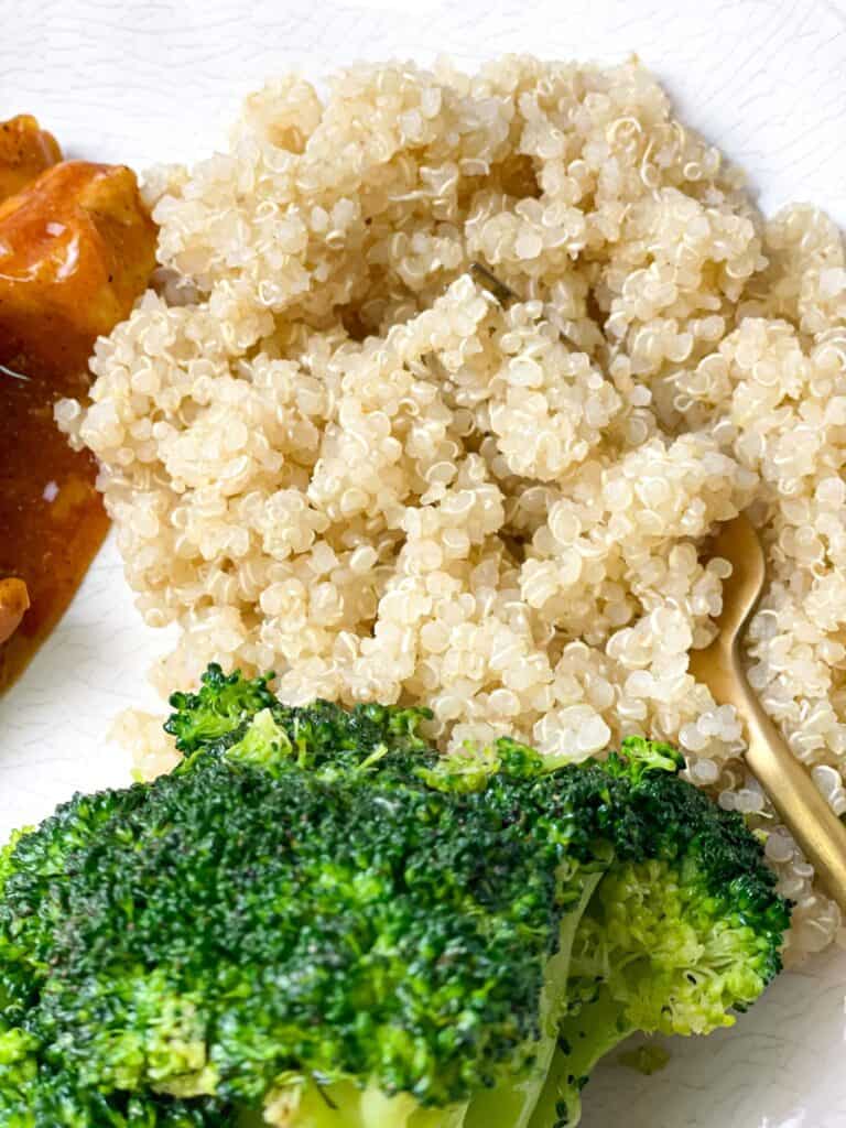 boiled fluffy quinoa with broccoli and chicken stew