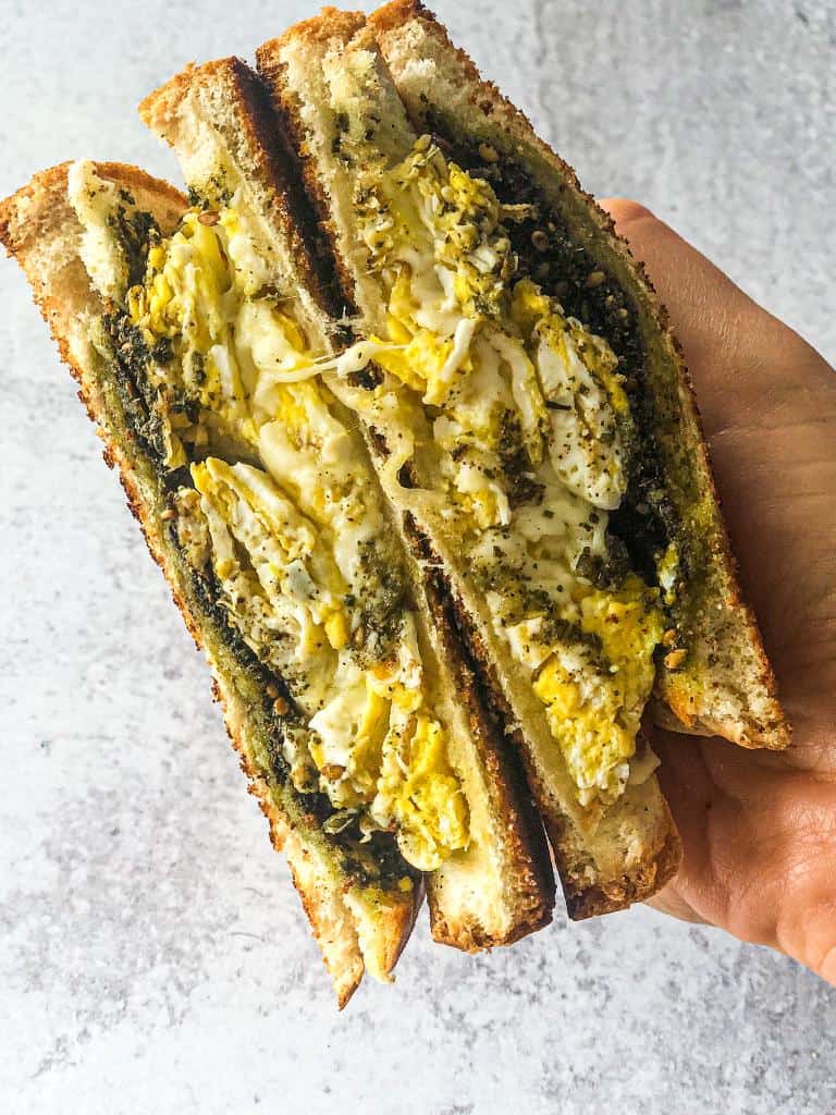 An amazingly tasty sandwich made up of two layers of toasted bread filled with a gourmet combo of zaatar, cheese, and eggs grilled in a skillet and all prepared in a very short time 