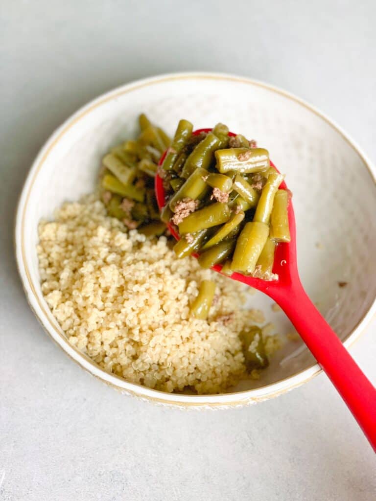 a delicious bowl of green bean and minced beef stew served with fluffy quinoa