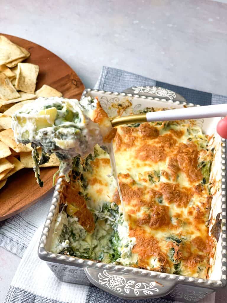 This Spinach Artichoke Dip is best served hot with a side of fresh veggies, pretzels, pita chips and much more!