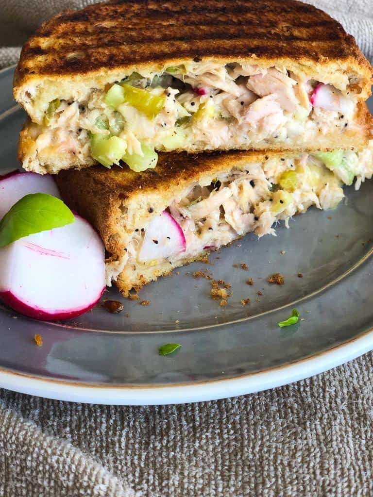 A mix of tuna, pickles, radish, gouda cheese and chopped celery sandwiched in toasted bread. 
