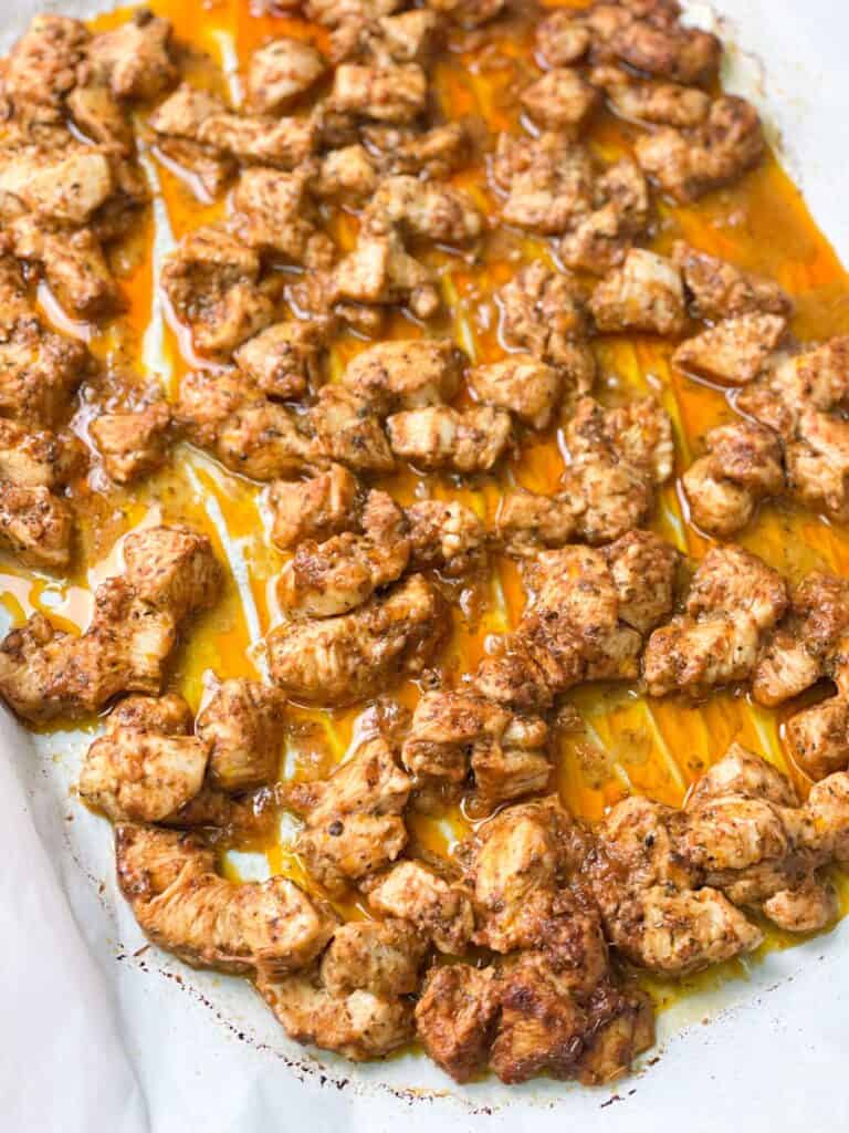 Chicken shish tawook marinated and cooked in a sheet pan in the oven is an easy meal.