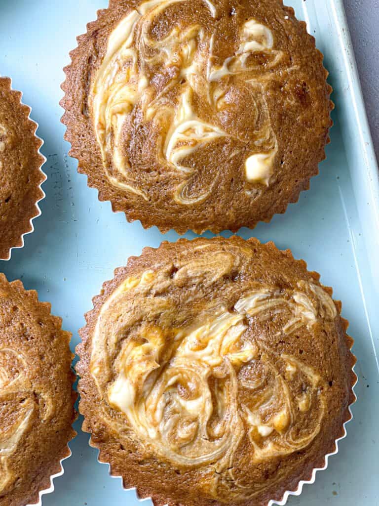 soft and moist pumpkin cream cheese swirl muffins that will make your house smell like autumn. 