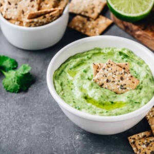 creamy avocado dip with cilantro and lime and drizzled with olive oil