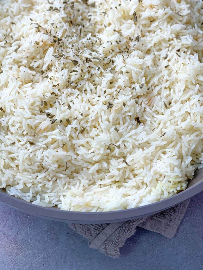 vegetarian garlic butter rice with fresh parsley sprinkled on top, The perfect side dish with your favorite veggies and meat