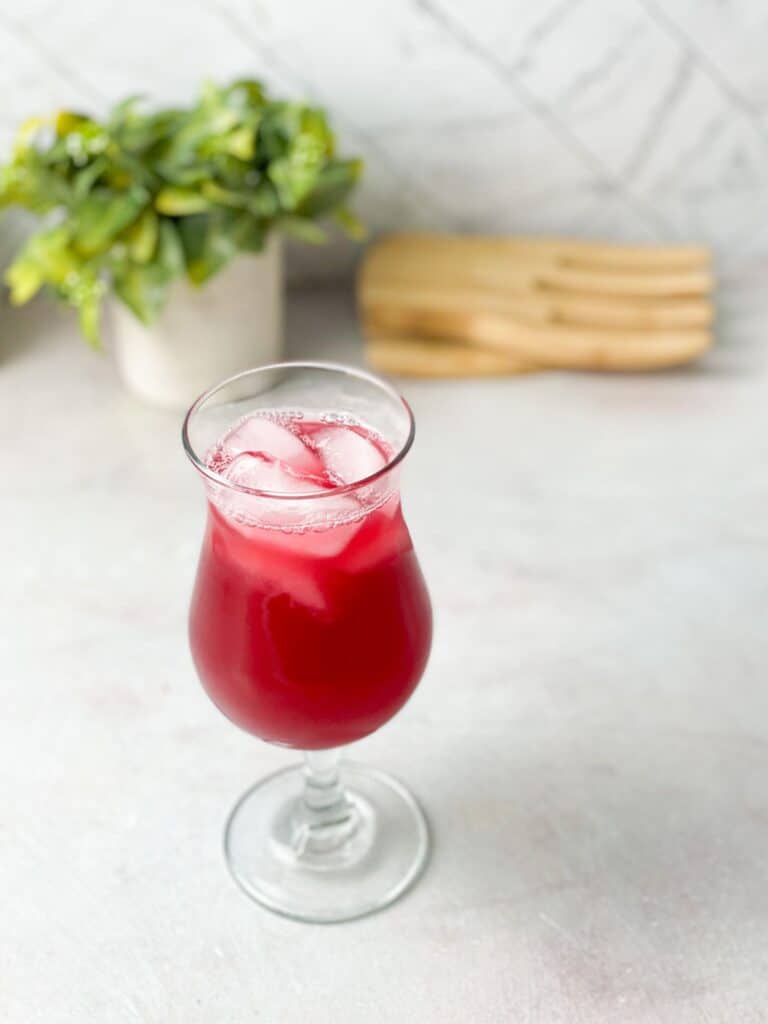 A glass of delicious cranberry juice made with only 3 ingredients, served chilled with a few ice cubes 