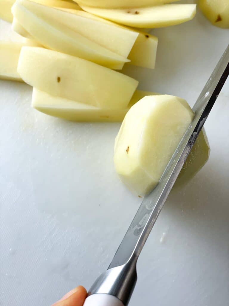 a whole potato cut into thin slices
