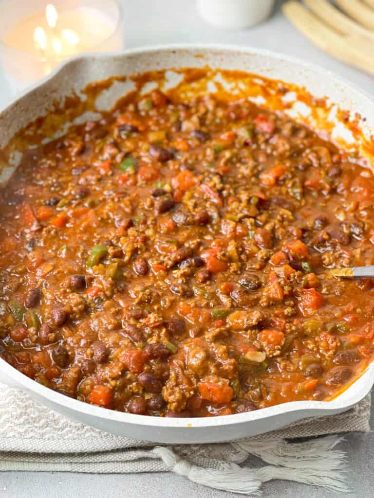 A big bowl of thick hearty chili served hot