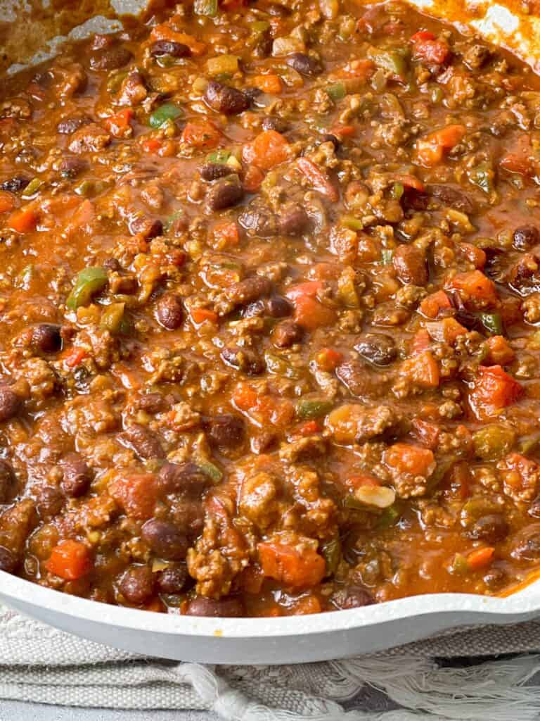 Close up of thick hearty chili in a serving bowl