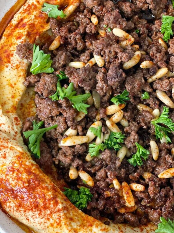Hummus plate with spicy ground meat and pine nuts