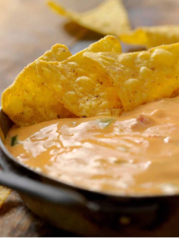 Mouthwatering melted cheese with nacho chips on the side.